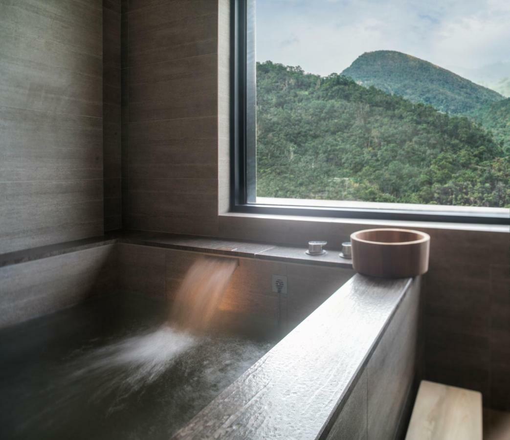 Mu Jiaoxi Hotel Exterior photo A modern onsen bath